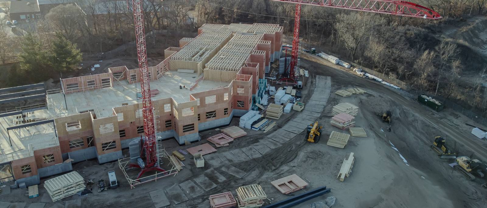 Aerial view of a construction laydown yard with materials and equipment